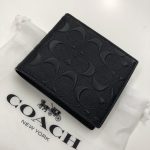 コーチ シグネチャー 二つ折り財布 エンボスレザー