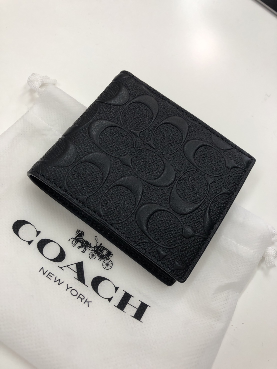 コーチ シグネチャー 二つ折り財布 エンボスレザー